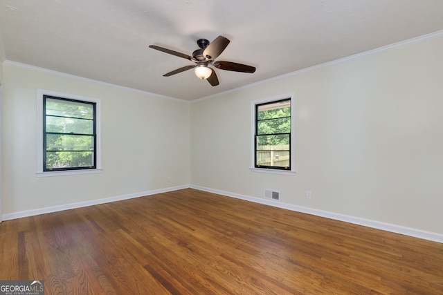 256 4th Ave, Winder, GA 30680 - spare room featuring wood finished floors, ornamental molding, and ceiling fan