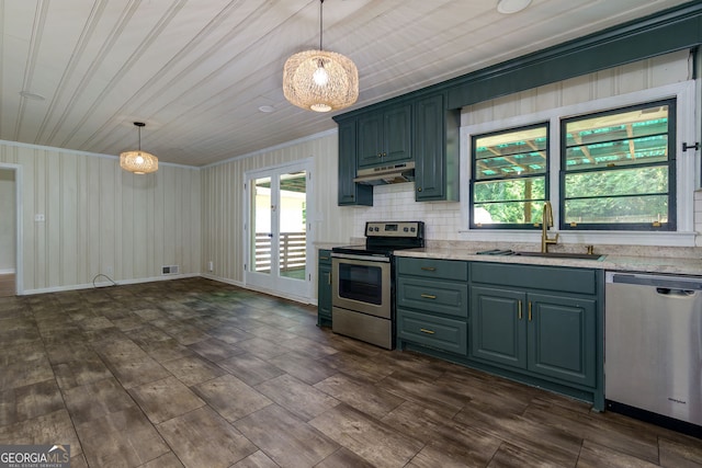 256 4th Ave, Winder, GA 30680 - kitchen with appliances with stainless steel finishes, light countertops, ornamental molding, under cabinet range hood, and plenty of natural light