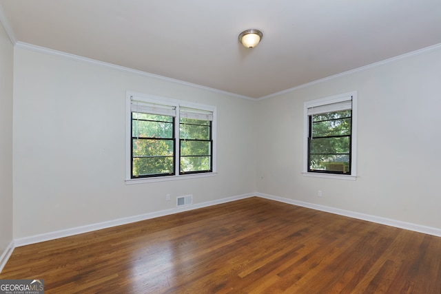 256 4th Ave, Winder, GA 30680 - empty room featuring ornamental molding and dark wood finished floors