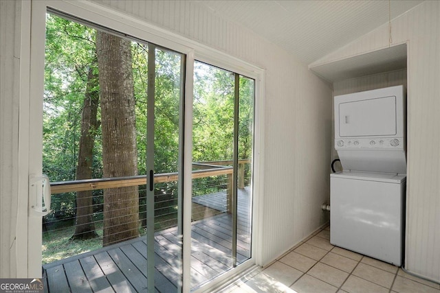 546 Pulaski St, Athens, GA 30601 - laundry area with stacked washer / dryer and light tile patterned flooring