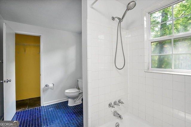 546 Pulaski St, Athens, GA 30601 - full bathroom featuring shower / bath combination, toilet, tile patterned floors, and a spacious closet