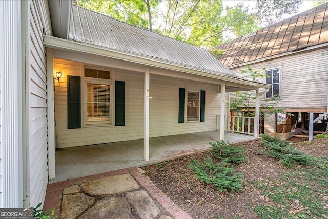 546 Pulaski St, Athens, GA 30601 - view of side of property with metal roof and a porch