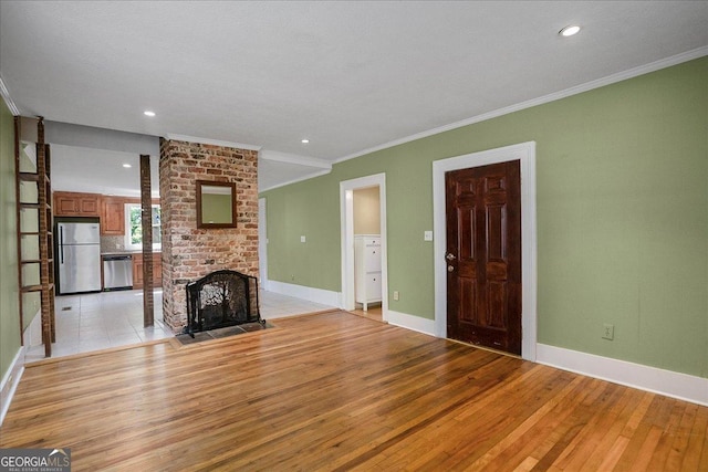 546 Pulaski St, Athens, GA 30601 - unfurnished living room featuring light wood-style floors, ornamental molding, a fireplace, baseboards, and recessed lighting