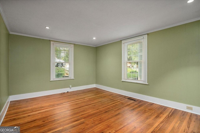 546 Pulaski St, Athens, GA 30601 - spare room with hardwood / wood-style flooring, crown molding, baseboards, and recessed lighting
