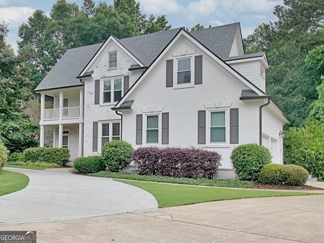 505 Lighthouse Ln, Peachtree City, GA 30269 - view of front of house with concrete driveway, a shingled roof, and a balcony