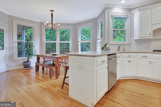 505 Lighthouse Ln, Peachtree City, GA 30269 - kitchen with dishwasher, a chandelier, light wood-style flooring, crown molding, and white cabinets
