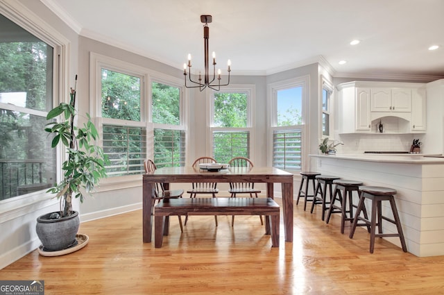 505 Lighthouse Ln, Peachtree City, GA 30269 - dining area with crown molding, healthy amount of natural light, light wood-style flooring, a chandelier, and recessed lighting