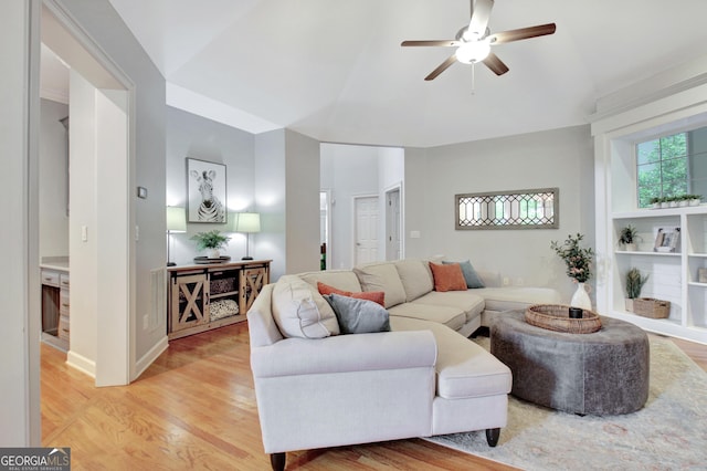 505 Lighthouse Ln, Peachtree City, GA 30269 - living area featuring vaulted ceiling, light wood-style flooring, and ceiling fan