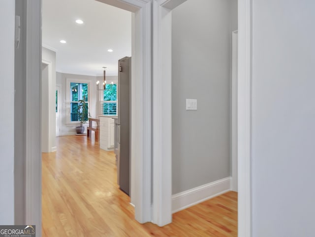 505 Lighthouse Ln, Peachtree City, GA 30269 - hall with light wood-type flooring, arched walkways, baseboards, recessed lighting, and crown molding