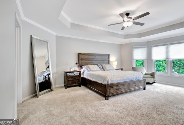 505 Lighthouse Ln, Peachtree City, GA 30269 - carpeted bedroom featuring a raised ceiling, crown molding, ceiling fan, and baseboards