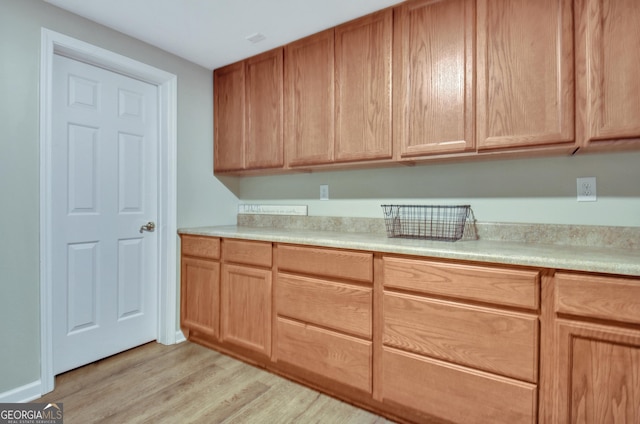 505 Lighthouse Ln, Peachtree City, GA 30269 - kitchen featuring light wood-type flooring and light countertops