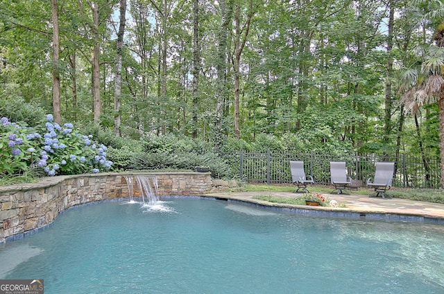 505 Lighthouse Ln, Peachtree City, GA 30269 - view of swimming pool featuring a forest view
