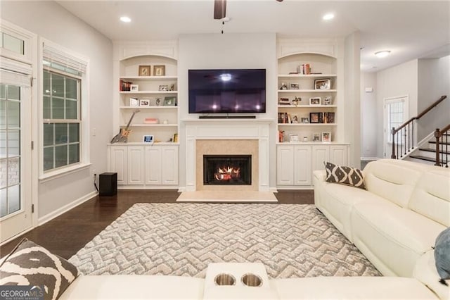 1896 Grove Field Ln Unit 29, Marietta, GA 30064 - living area featuring ceiling fan, a warm lit fireplace, baseboards, stairway, and dark wood finished floors