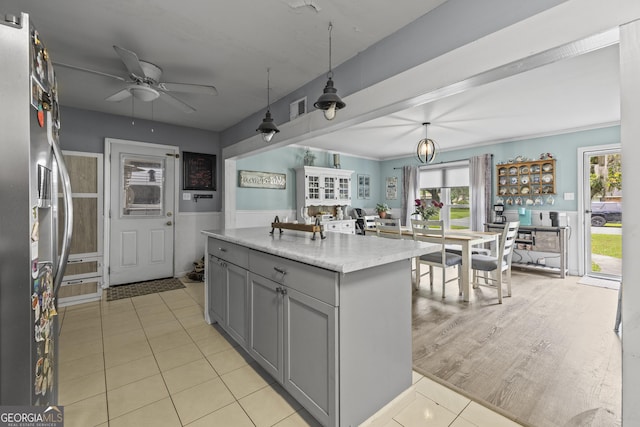 314 Clifton Dr, Port Wentworth, GA 31407 - kitchen featuring stainless steel fridge with ice dispenser, gray cabinets, ceiling fan, and healthy amount of natural light