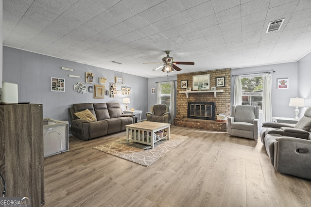 314 Clifton Dr, Port Wentworth, GA 31407 - living area with wood finished floors, ceiling fan, and a brick fireplace