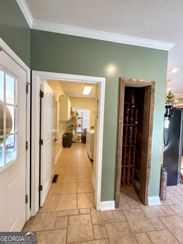 657 Halls Bridge Rd, Swainsboro, GA 30401 - corridor featuring crown molding, a textured ceiling, and baseboards