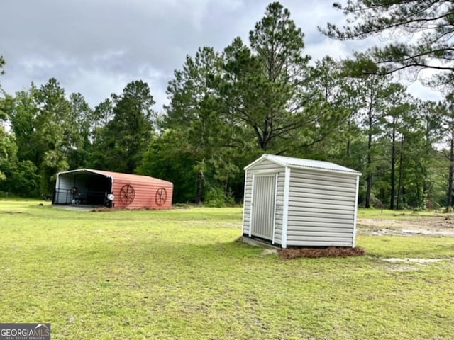 657 Halls Bridge Rd, Swainsboro, GA 30401 - view of grassy yard featuring a detached carport