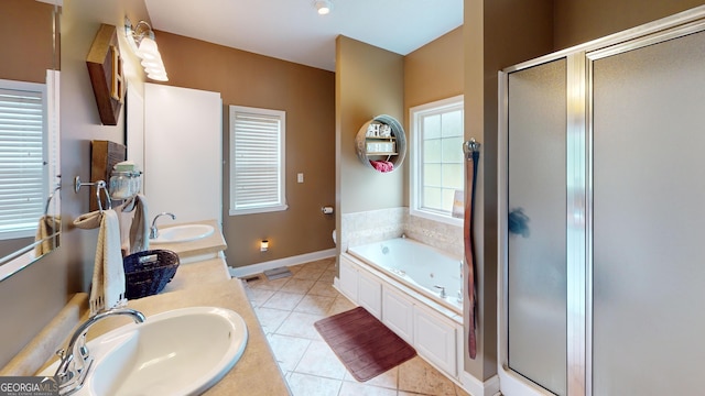 657 Halls Bridge Rd, Swainsboro, GA 30401 - full bathroom with a shower stall, a bath, double vanity, tile patterned floors, and toilet