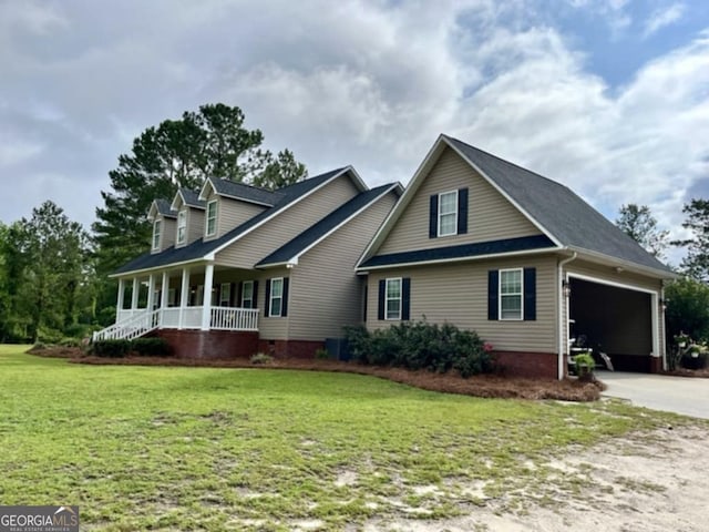 657 Halls Bridge Rd, Swainsboro, GA 30401 - view of front of home featuring covered porch, a garage, concrete driveway, and a front yard