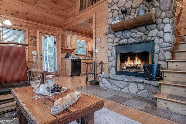 9 Dean Ct, Blue Ridge, GA 30513 - living room with a stone fireplace, light wood-style floors, wooden walls, and high vaulted ceiling
