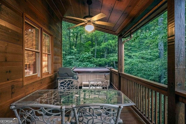 9 Dean Ct, Blue Ridge, GA 30513 - wooden deck with a hot tub, ceiling fan, outdoor dining area, and a view of trees