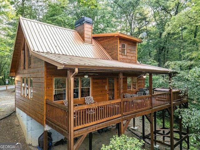 9 Dean Ct, Blue Ridge, GA 30513 - rear view of house with a chimney, metal roof, and a deck
