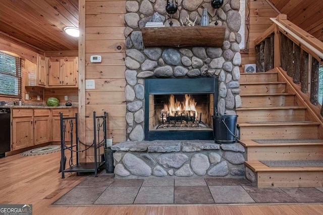 9 Dean Ct, Blue Ridge, GA 30513 - detailed view of wood finished floors, dishwasher, wood ceiling, wooden walls, and a fireplace