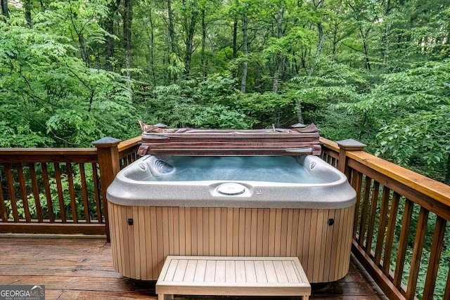 9 Dean Ct, Blue Ridge, GA 30513 - wooden terrace with a hot tub and a forest view