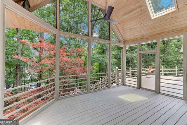 2230 Huntingdon Ct, Gainesville, GA 30506 - unfurnished sunroom with a skylight, view of wooded area, and vaulted ceiling