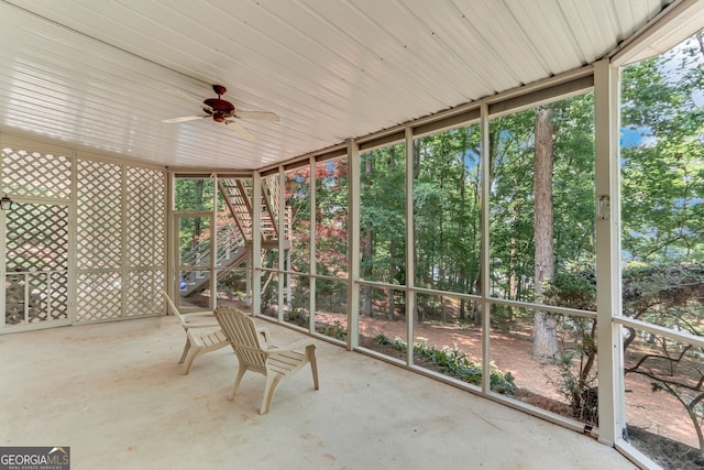 2230 Huntingdon Ct, Gainesville, GA 30506 - unfurnished sunroom featuring ceiling fan and view of wooded area