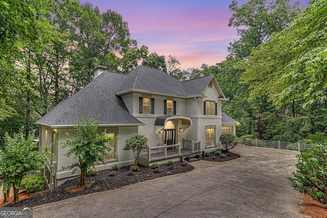 2230 Huntingdon Ct, Gainesville, GA 30506 - view of front of house with stucco siding, concrete driveway, a shingled roof, a chimney, and a garage