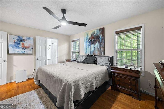 69 Due W Pass, Dallas, GA 30157 - bedroom with wood finished floors, a textured ceiling, and a ceiling fan