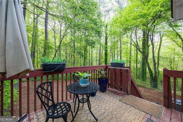 69 Due W Pass, Dallas, GA 30157 - view of patio featuring a forest view