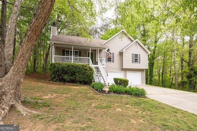 69 Due W Pass, Dallas, GA 30157 - view of front of home with a porch, stairway, a chimney, driveway, and an attached garage