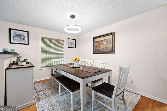 69 Due W Pass, Dallas, GA 30157 - dining space with light wood-style floors and a textured ceiling