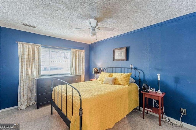 1705 Monroe Dr NE Unit D05, Atlanta, GA 30324 - bedroom with a textured ceiling, carpet, and a ceiling fan
