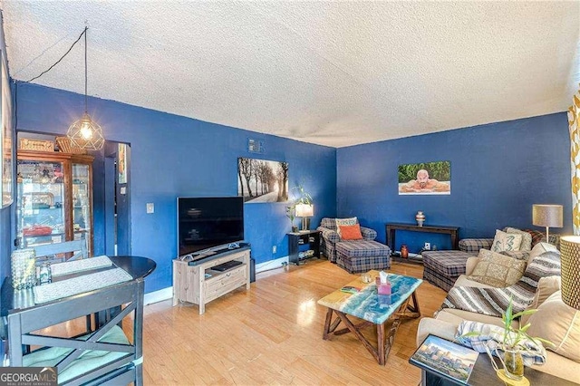 1705 Monroe Dr NE Unit D05, Atlanta, GA 30324 - living area featuring a textured ceiling and wood finished floors