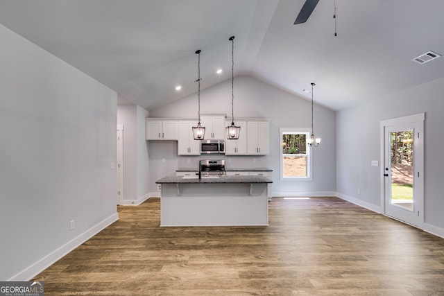 TRACT3 Georgia Highway 100, Buchanan, GA 30113 - kitchen with appliances with stainless steel finishes, white cabinetry, dark wood-style flooring, a center island with sink, and high vaulted ceiling