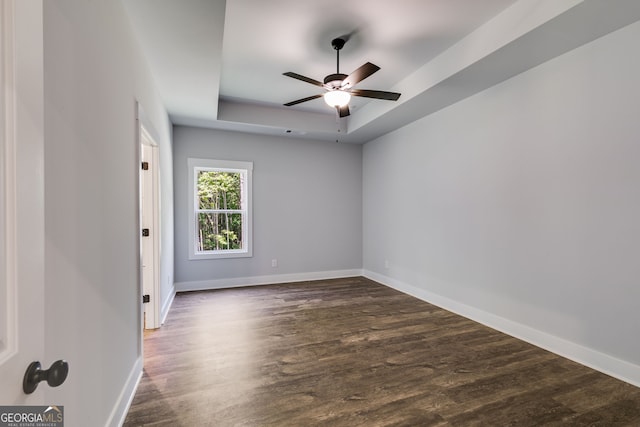 TRACT3 Georgia Highway 100, Buchanan, GA 30113 - spare room featuring a raised ceiling, dark wood-style flooring, and a ceiling fan