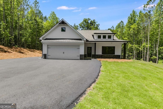 TRACT3 Georgia Highway 100, Buchanan, GA 30113 - modern farmhouse with an attached garage, asphalt driveway, stone siding, a front lawn, and roof with shingles