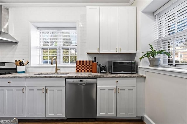 802 Frederica St NE Unit 5, Atlanta, GA 30306 - kitchen featuring appliances with stainless steel finishes, a sink, white cabinets, backsplash, and crown molding