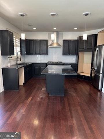 121 Fountain Oak, Villa Rica, GA 30180 - kitchen with freestanding refrigerator, extractor fan, a center island, dark wood-type flooring, and pendant lighting
