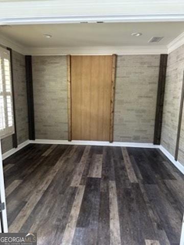 121 Fountain Oak, Villa Rica, GA 30180 - spare room with crown molding and dark wood-type flooring