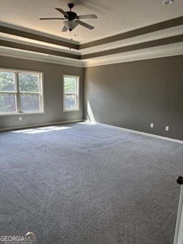 121 Fountain Oak, Villa Rica, GA 30180 - unfurnished room featuring ceiling fan, carpet, a tray ceiling, and crown molding