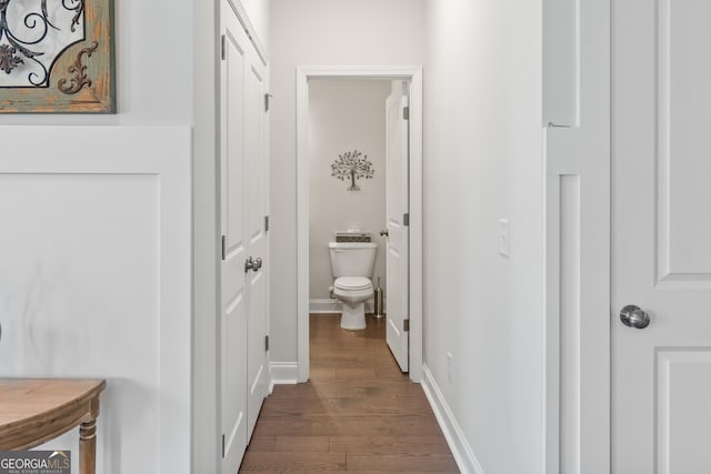2884 Porches Ln, Dacula, GA 30019 - hall with dark wood-style flooring and baseboards