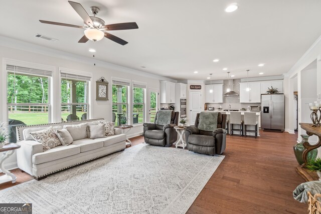 2884 Porches Ln, Dacula, GA 30019 - living room featuring ornamental molding, ceiling fan, recessed lighting, and dark wood finished floors