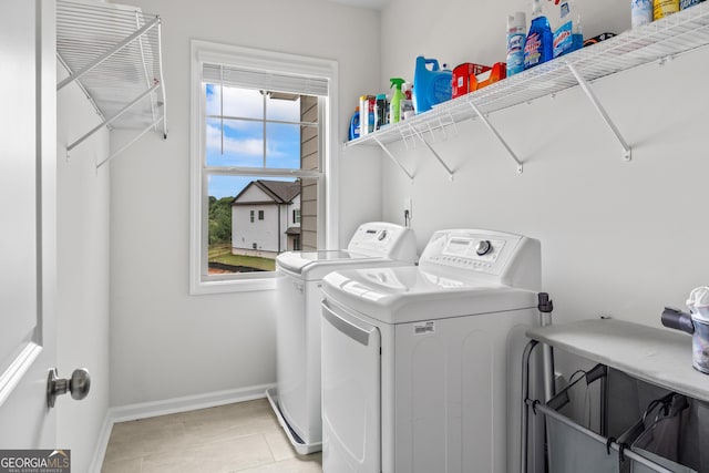 2884 Porches Ln, Dacula, GA 30019 - laundry room with independent washer and dryer, baseboards, and light tile patterned floors
