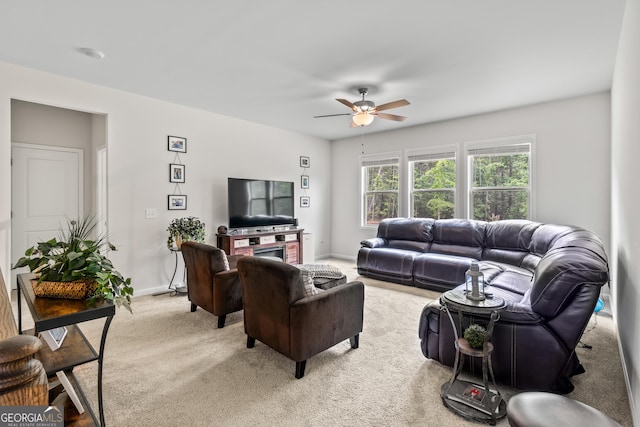 2884 Porches Ln, Dacula, GA 30019 - living room featuring light colored carpet, a ceiling fan, and baseboards