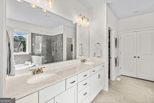2884 Porches Ln, Dacula, GA 30019 - full bathroom with double vanity, a stall shower, and a bathtub