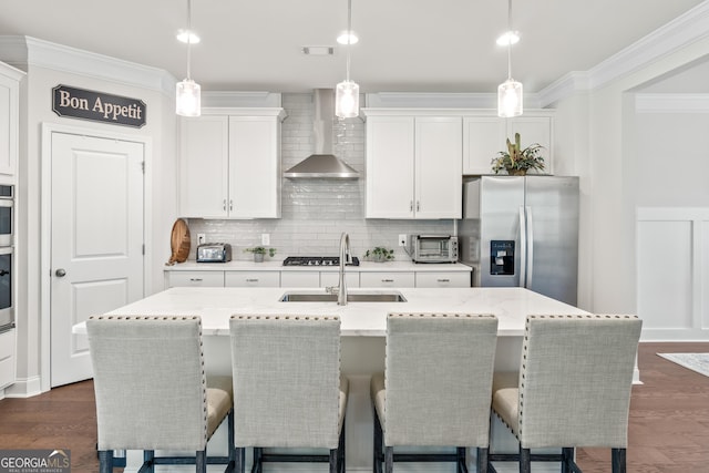 2884 Porches Ln, Dacula, GA 30019 - kitchen with stainless steel fridge with ice dispenser, wall chimney exhaust hood, crown molding, a sink, and a kitchen island with sink